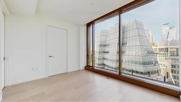 a view of an entryway with a floor to ceiling window