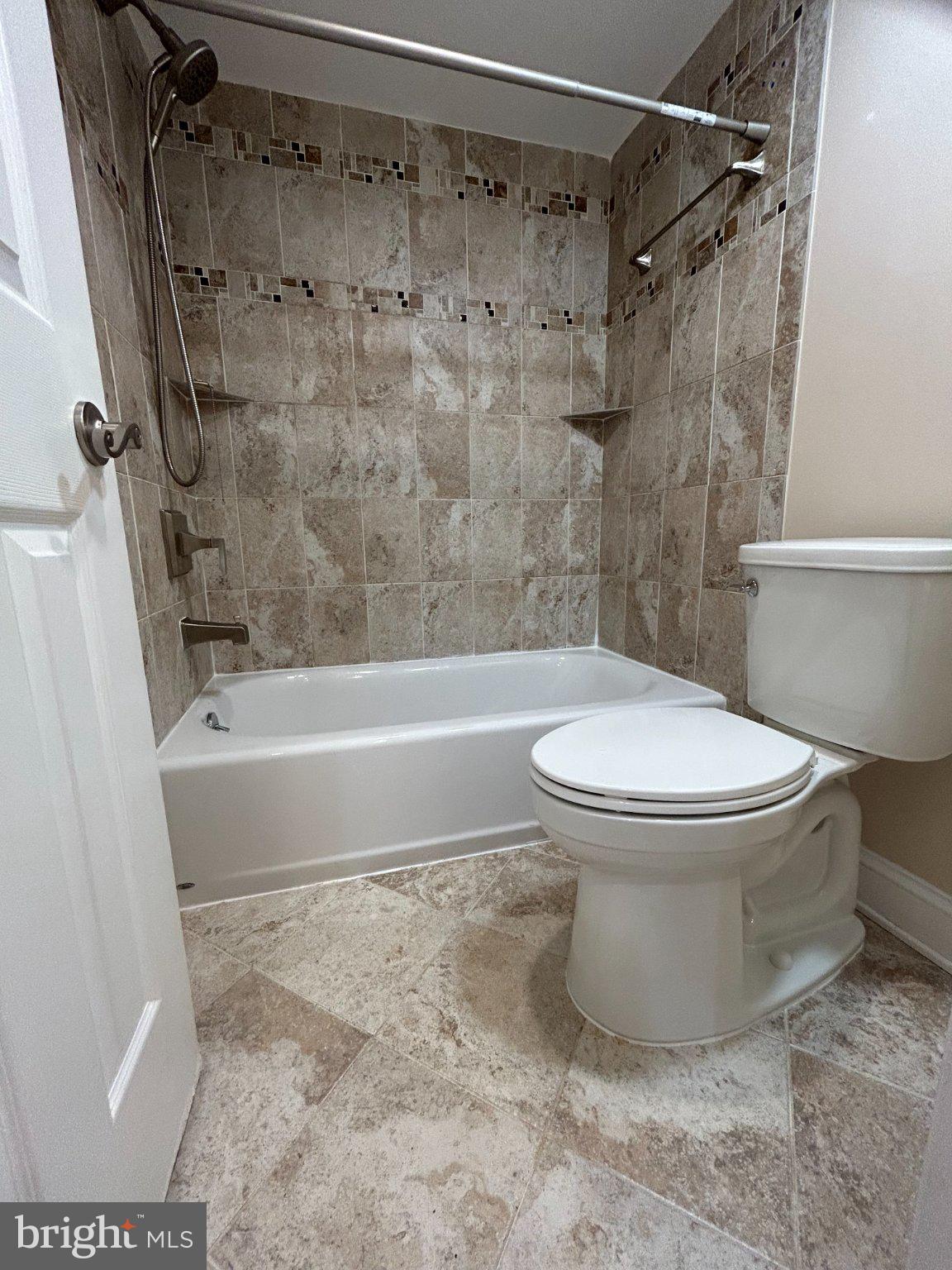 5802 Royal Ridge Drive, Unit B Springfield, VA 22152 - Photo 15 of 33 Tiled Bathroom Wall & Floor