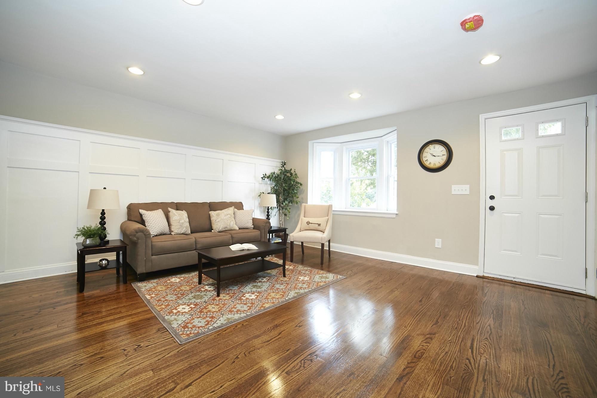 3909 Ednor Road Baltimore, MD 21218 - Photo 3 of 30 a living room with furniture and wooden floor