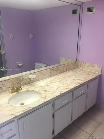 a bathroom with a glass door