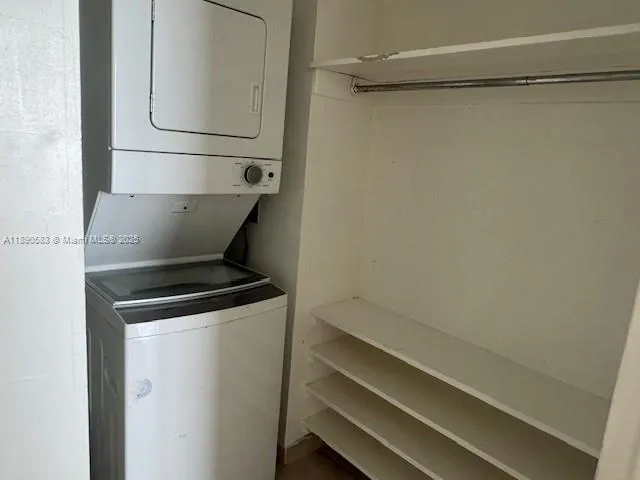 a kitchen with a sink cabinets and stainless steel appliances