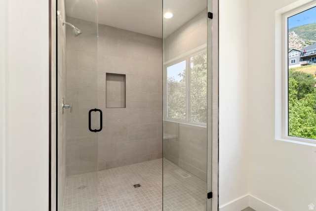 504 North 650 E Street Springville, UT 84663 - Photo 17 of 36 Glass-enclosed shower with light-toned wall tile and complementary floor tiling
