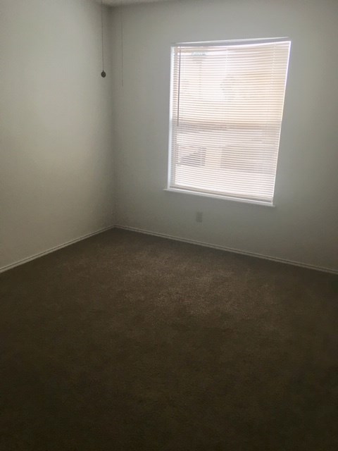 6702 Everhart Road, Unit N104 Corpus Christi, TX 78413 - Photo 3 of 6 an empty room with a window