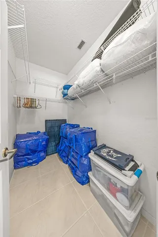 a view of storage and utility room with racks on the wall