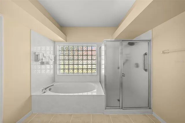 a bathroom with a bathtub and shower
