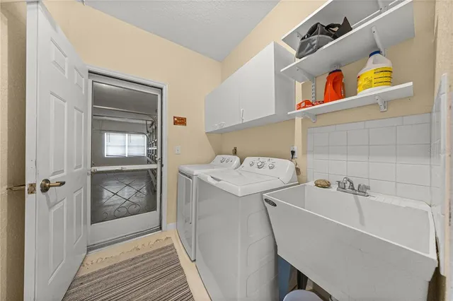 a utility room with dryer and washer
