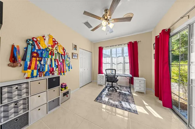 a living room with furniture cabinets and window
