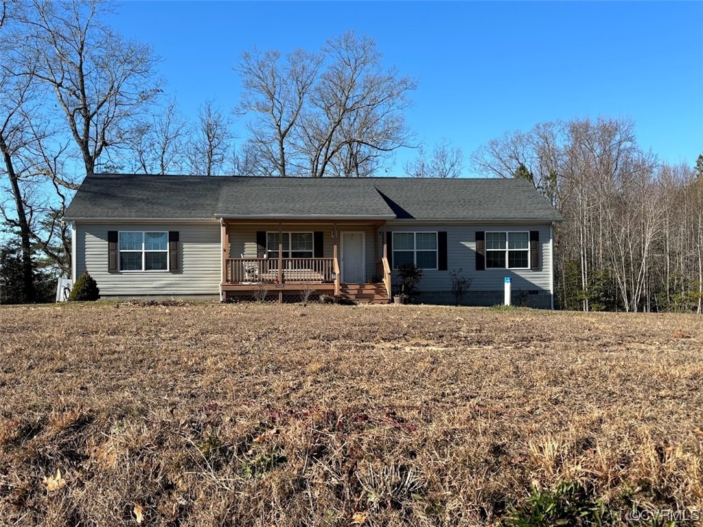 1406 Sharps Road Warsaw, VA 22572 - Photo 1 of 1 a front view of a house with garden