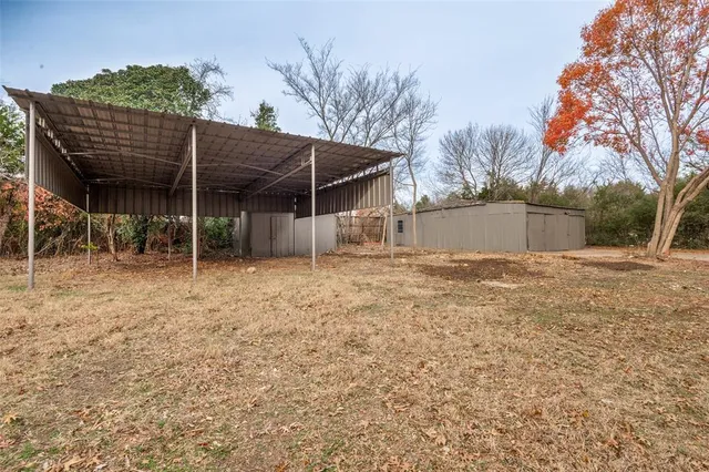 a backyard of a house with lots of green space