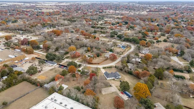 an aerial view of multiple houses with outdoor space