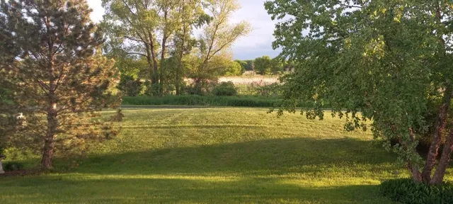 a view of a balcony with mountain view and wooden floor