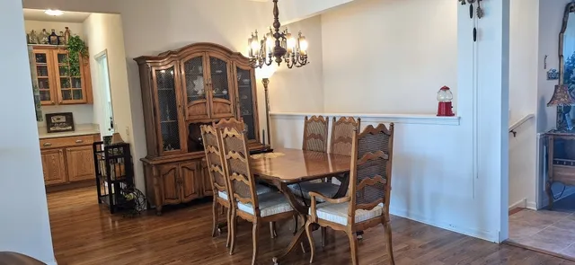 a bedroom with a bed and a flat tv screen on the dresser