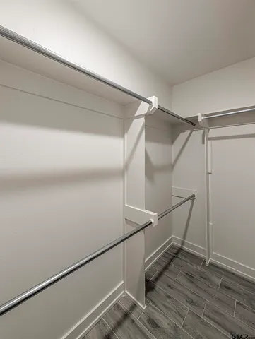 a view of an empty walk in closet