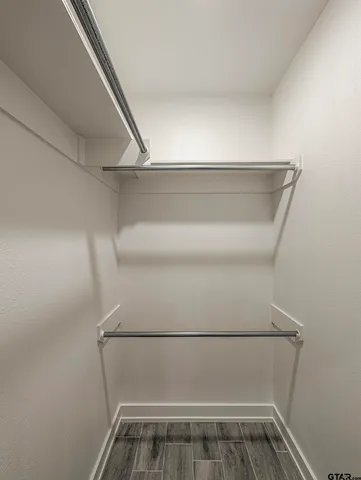 a view of storage and utility room with racks on the wall