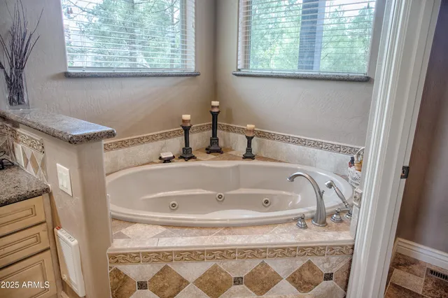 a bathroom with a sink and a window