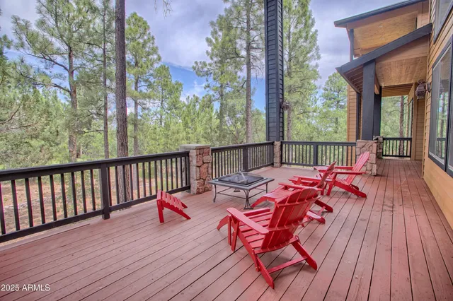 a balcony with furniture and wooden floor