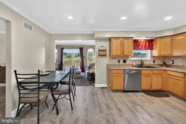 a kitchen with a sink cabinets and window