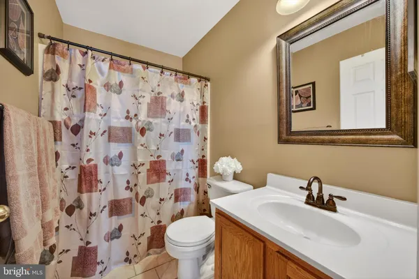 a view of walk in closet with clothes