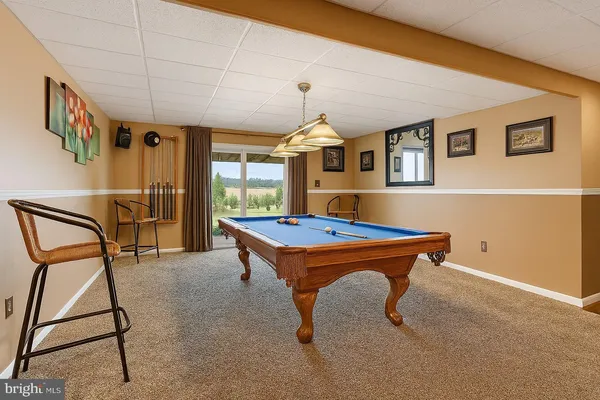 a bedroom with a bed and a lamp