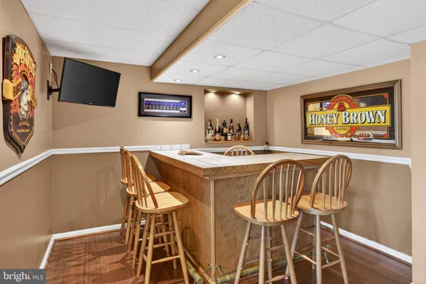 a white toilet sitting next to a bathroom sink