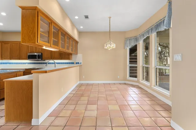 a view of a kitchen with windows