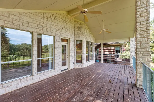 a view of a balcony with wooden floor
