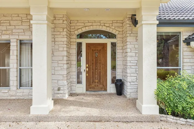 front view of a brick house with a outdoor space