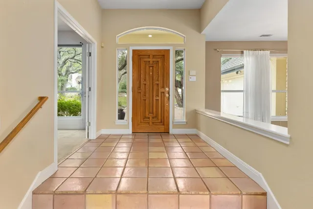 a view of an entryway with a floor to ceiling window