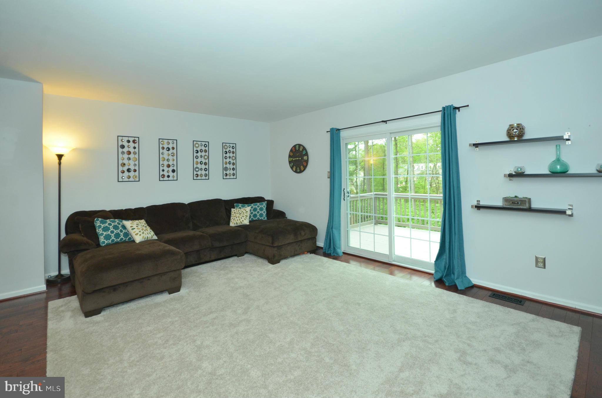 936 Walnut Wood Road Cockeysville, MD 21030 - Photo 8 of 27 Living Room w/ slider to newly painted deck