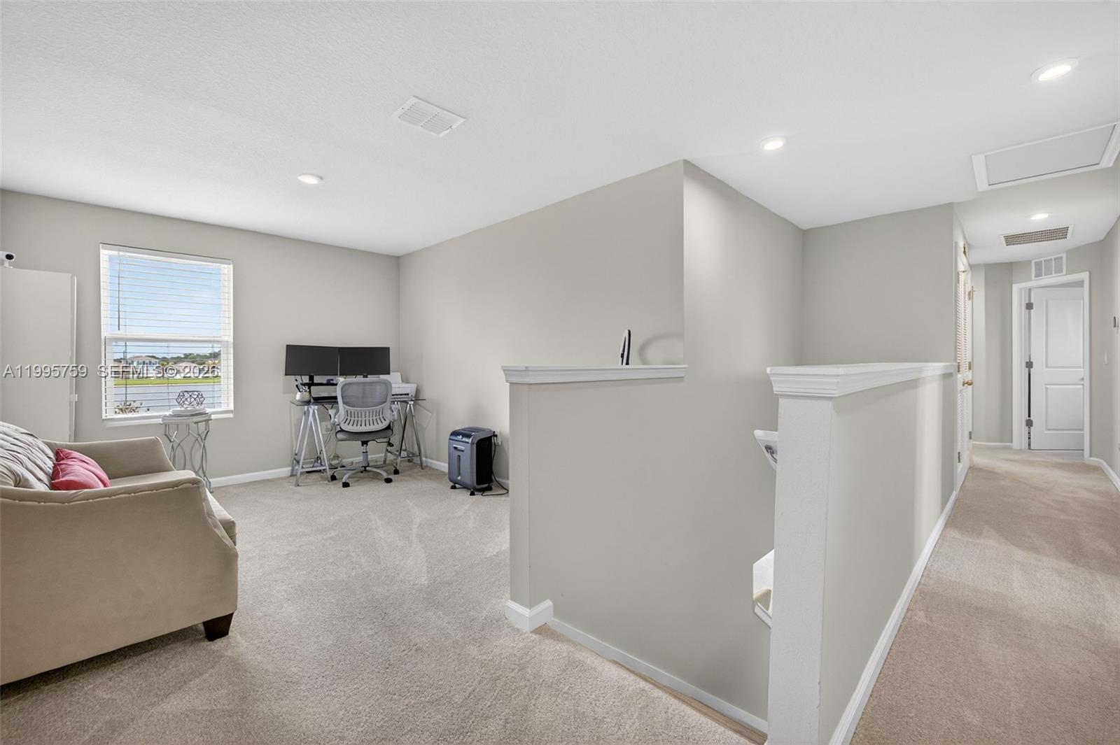 220 Raspberry Road Fort Pierce, FL 34981 - Photo 19 of 43 a living room with furniture and a flat screen tv