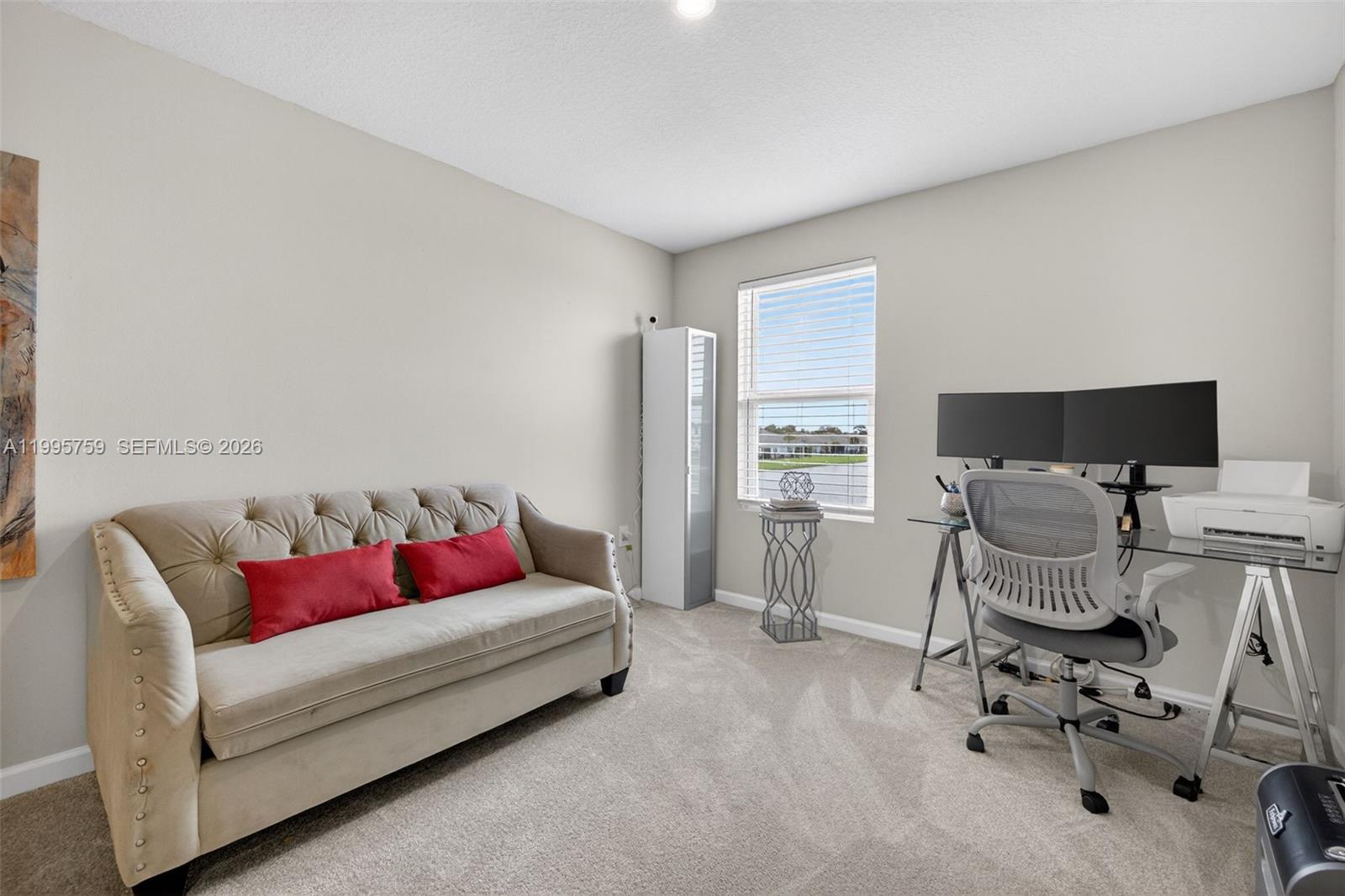 220 Raspberry Road Fort Pierce, FL 34981 - Photo 20 of 43 a living room with furniture and a flat screen tv