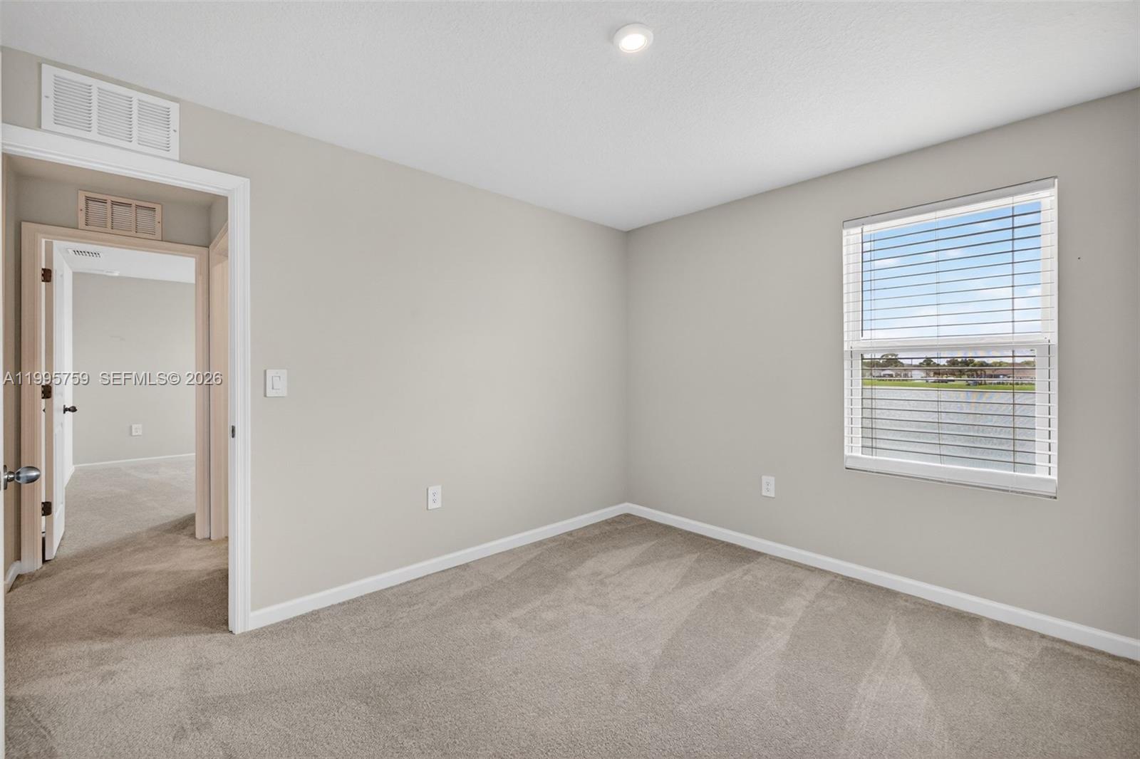 220 Raspberry Road Fort Pierce, FL 34981 - Photo 30 of 43 a view of an empty room with a window