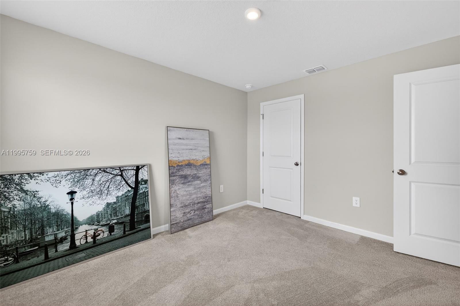 220 Raspberry Road Fort Pierce, FL 34981 - Photo 31 of 43 a view of an empty room with garage and window
