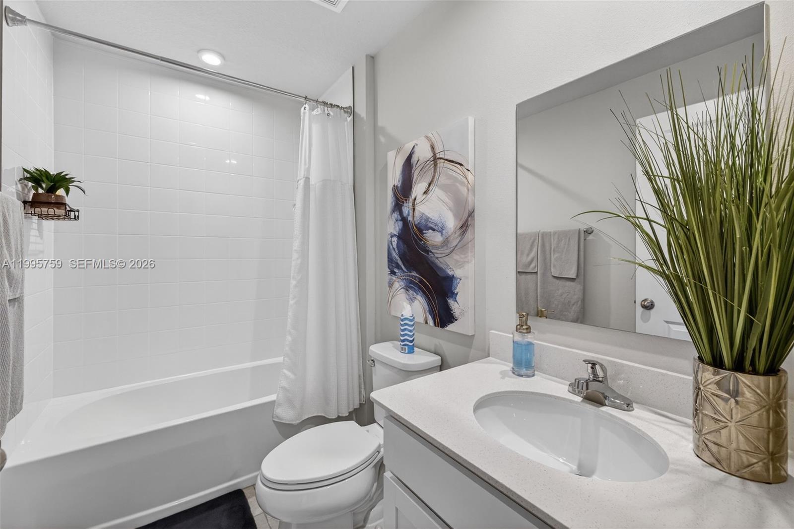 220 Raspberry Road Fort Pierce, FL 34981 - Photo 32 of 43 a bathroom with a sink a toilet and shower