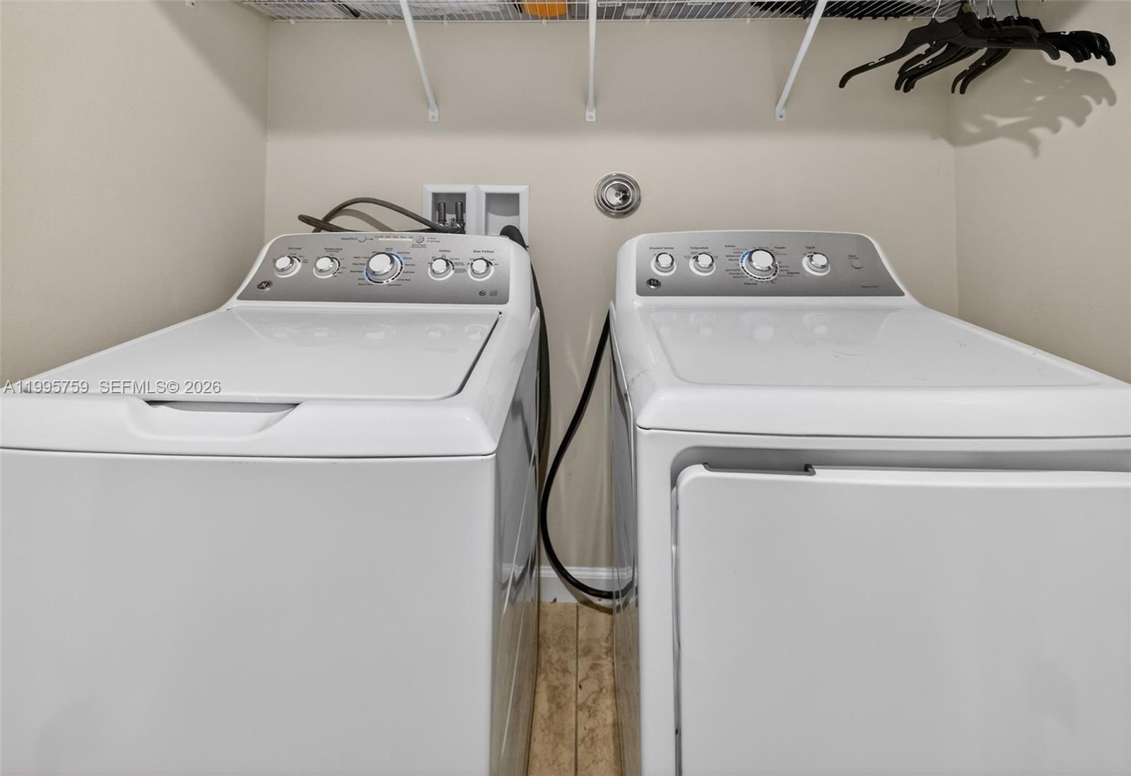 220 Raspberry Road Fort Pierce, FL 34981 - Photo 35 of 43 a utility room with dryer and washer