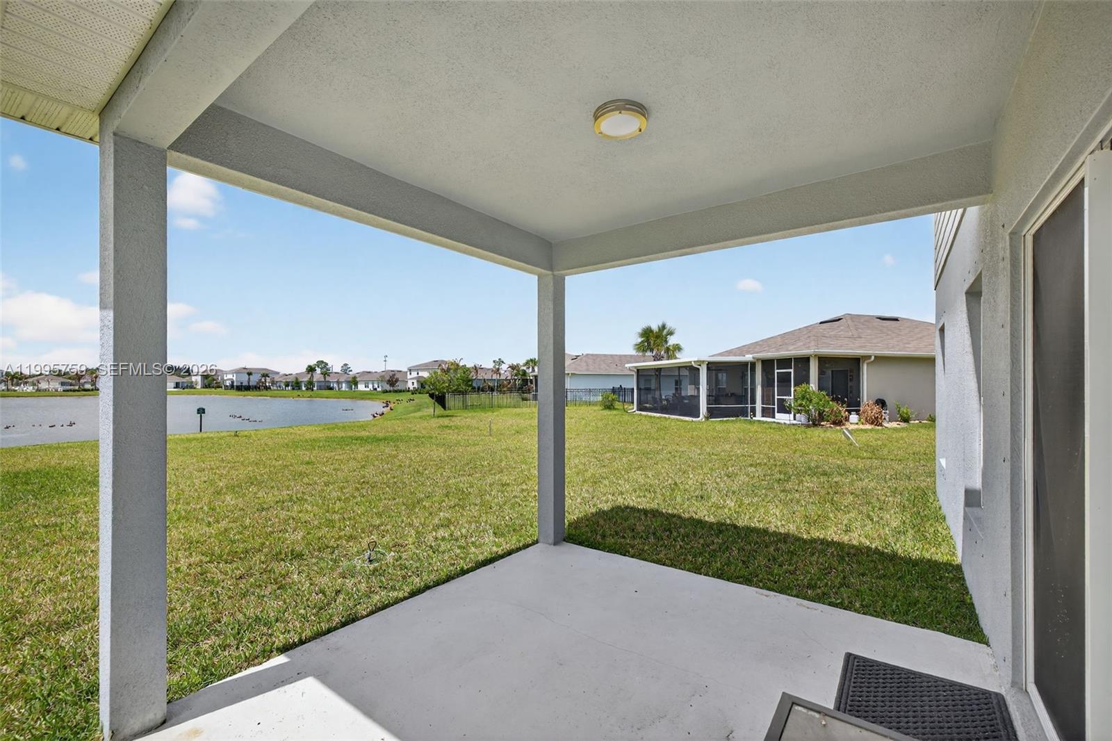 220 Raspberry Road Fort Pierce, FL 34981 - Photo 37 of 43 a front view of a house with a yard