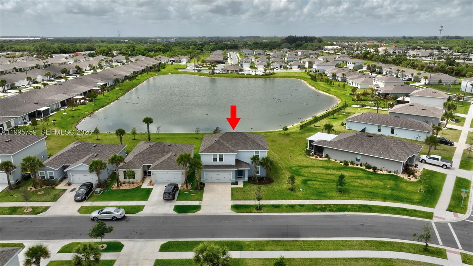 220 Raspberry Road Fort Pierce, FL 34981 - Photo 42 of 43 an aerial view of a house with a swimming pool