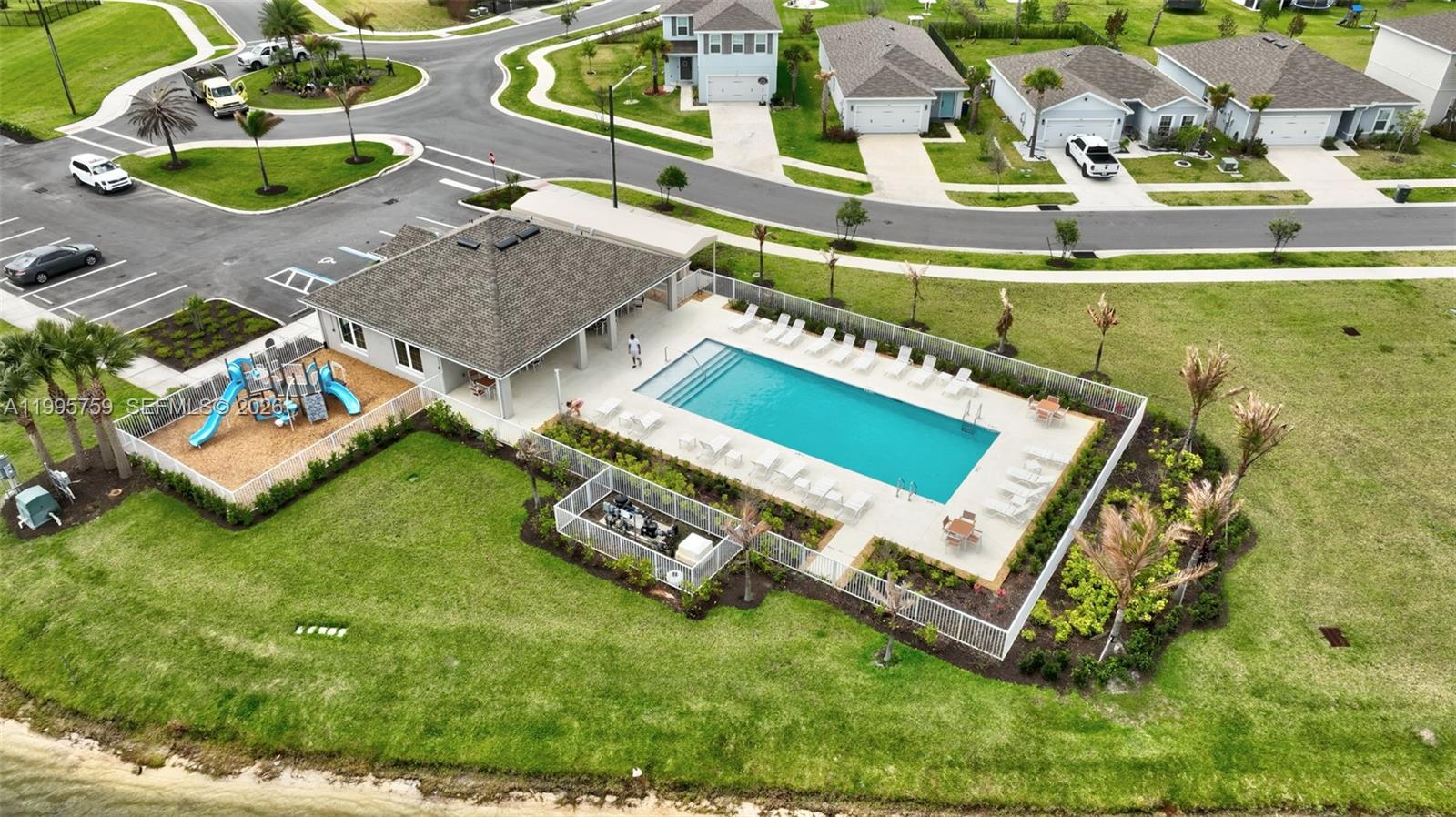220 Raspberry Road Fort Pierce, FL 34981 - Photo 43 of 43 an aerial view of a house with a garden