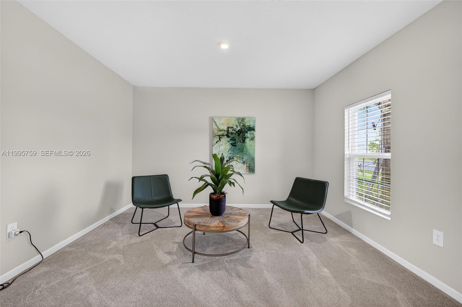 220 Raspberry Road Fort Pierce, FL 34981 - Photo 5 of 43 a living room with furniture and a potted plant