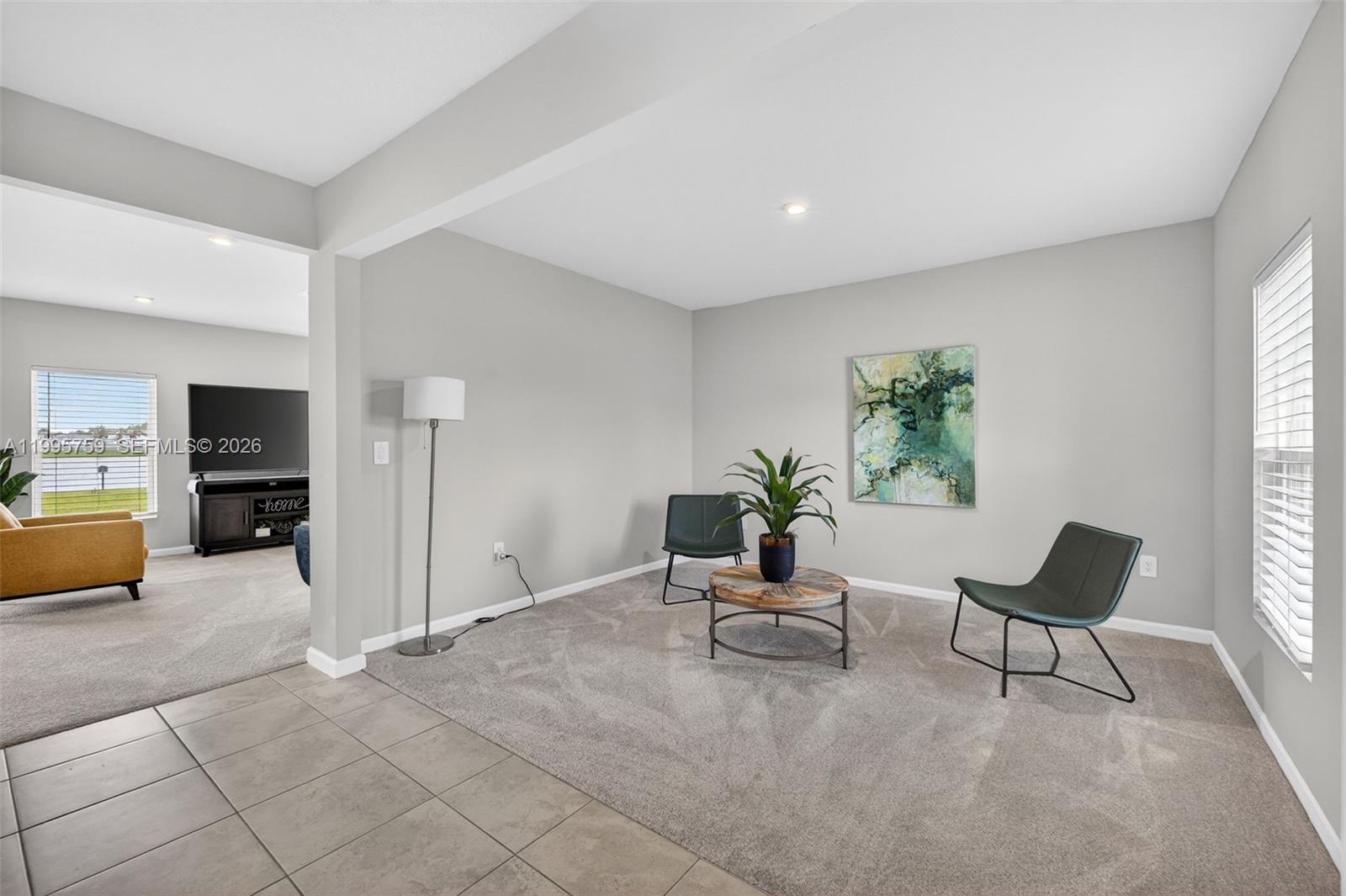 220 Raspberry Road Fort Pierce, FL 34981 - Photo 6 of 43 a living room with furniture and a flat screen tv