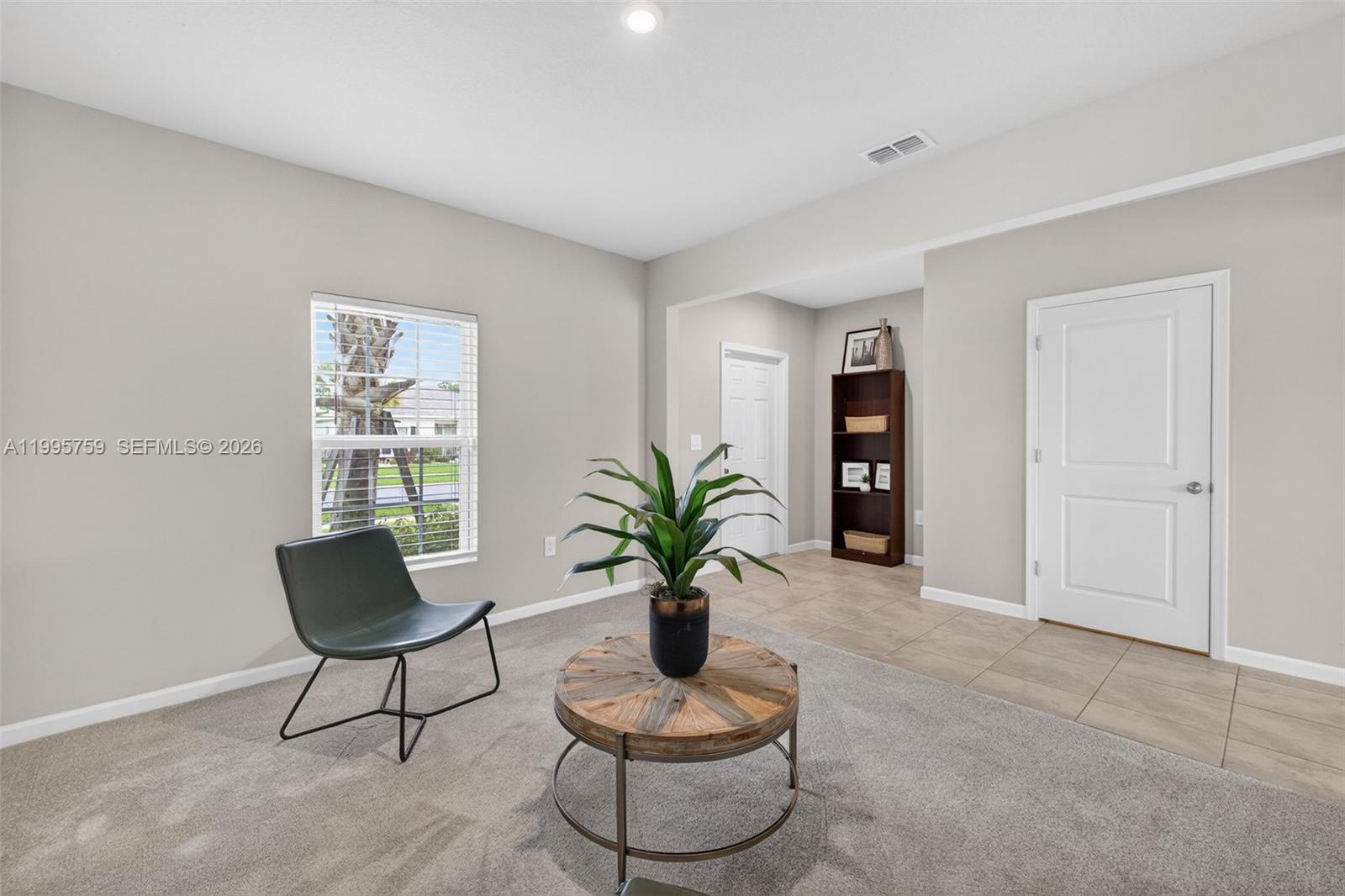 220 Raspberry Road Fort Pierce, FL 34981 - Photo 7 of 43 a view of living room with furniture and a potted plant