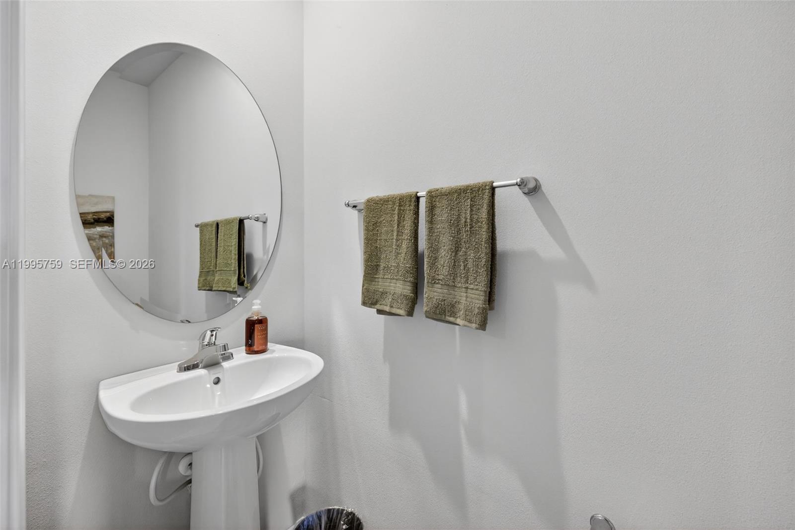 220 Raspberry Road Fort Pierce, FL 34981 - Photo 8 of 43 a bathroom with a sink and a mirror