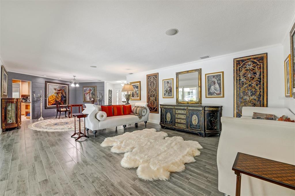 1875 Belleair Road Clearwater, FL 33764 - Photo 59 of 100 a living room with furniture and a flat screen tv