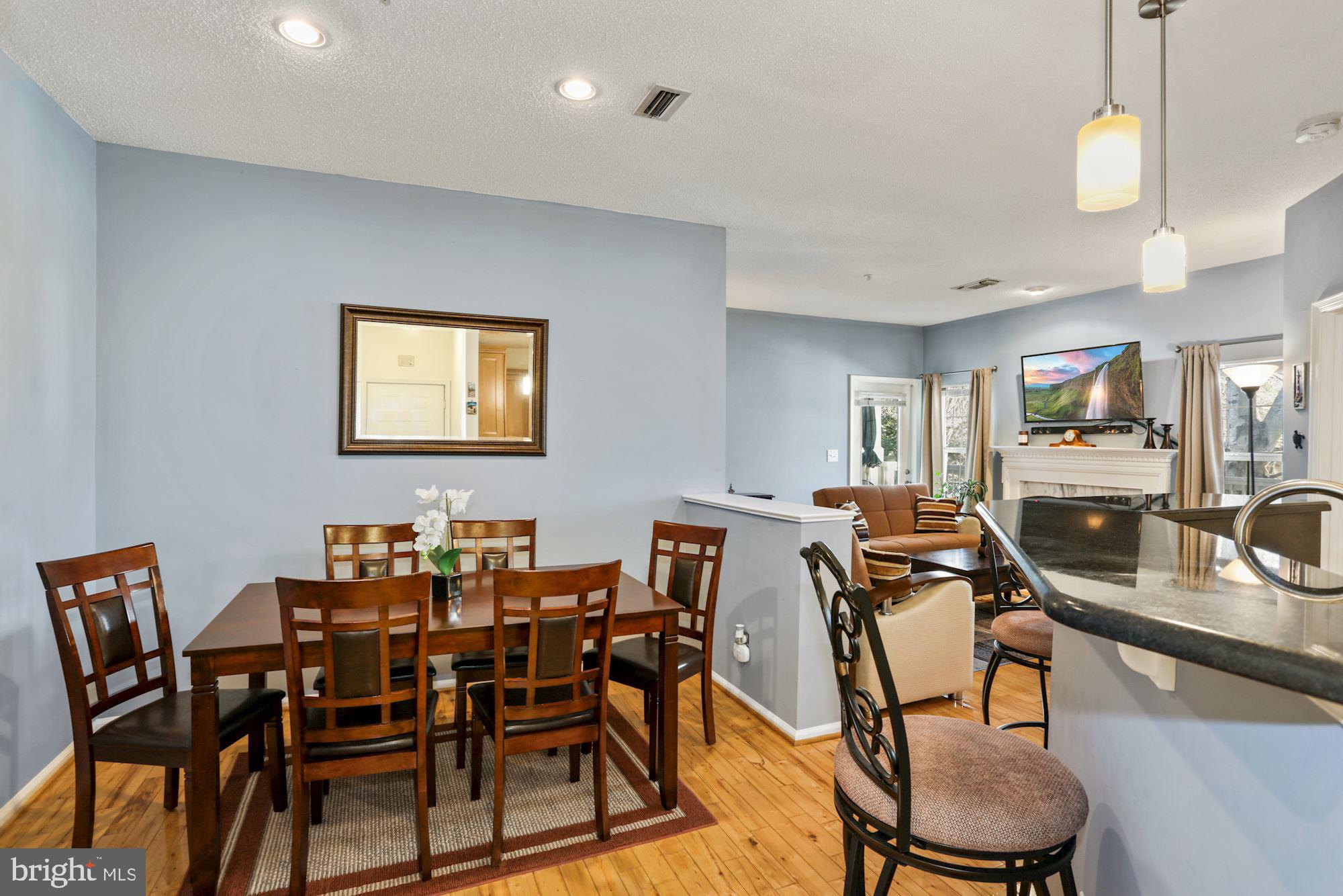 1720 Lake Shore Crest Drive, Unit 22 Reston, VA 20190 - Photo 13 of 35 Separate Dining Room with Hardwood floors