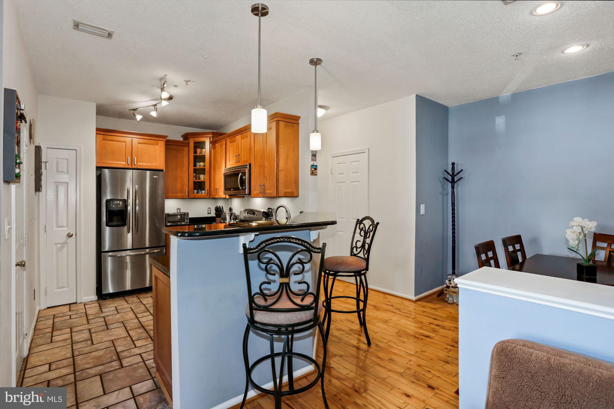 1720 Lake Shore Crest Drive, Unit 22 Reston, VA 20190 - Photo 15 of 35 Breakfast Bar with room for seating!