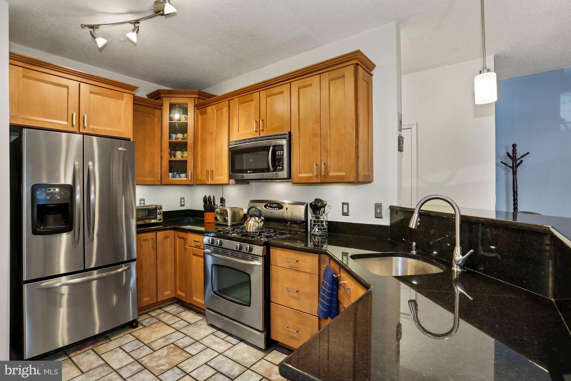 1720 Lake Shore Crest Drive, Unit 22 Reston, VA 20190 - Photo 17 of 35 Gorgeous tile floors in Kitchen!