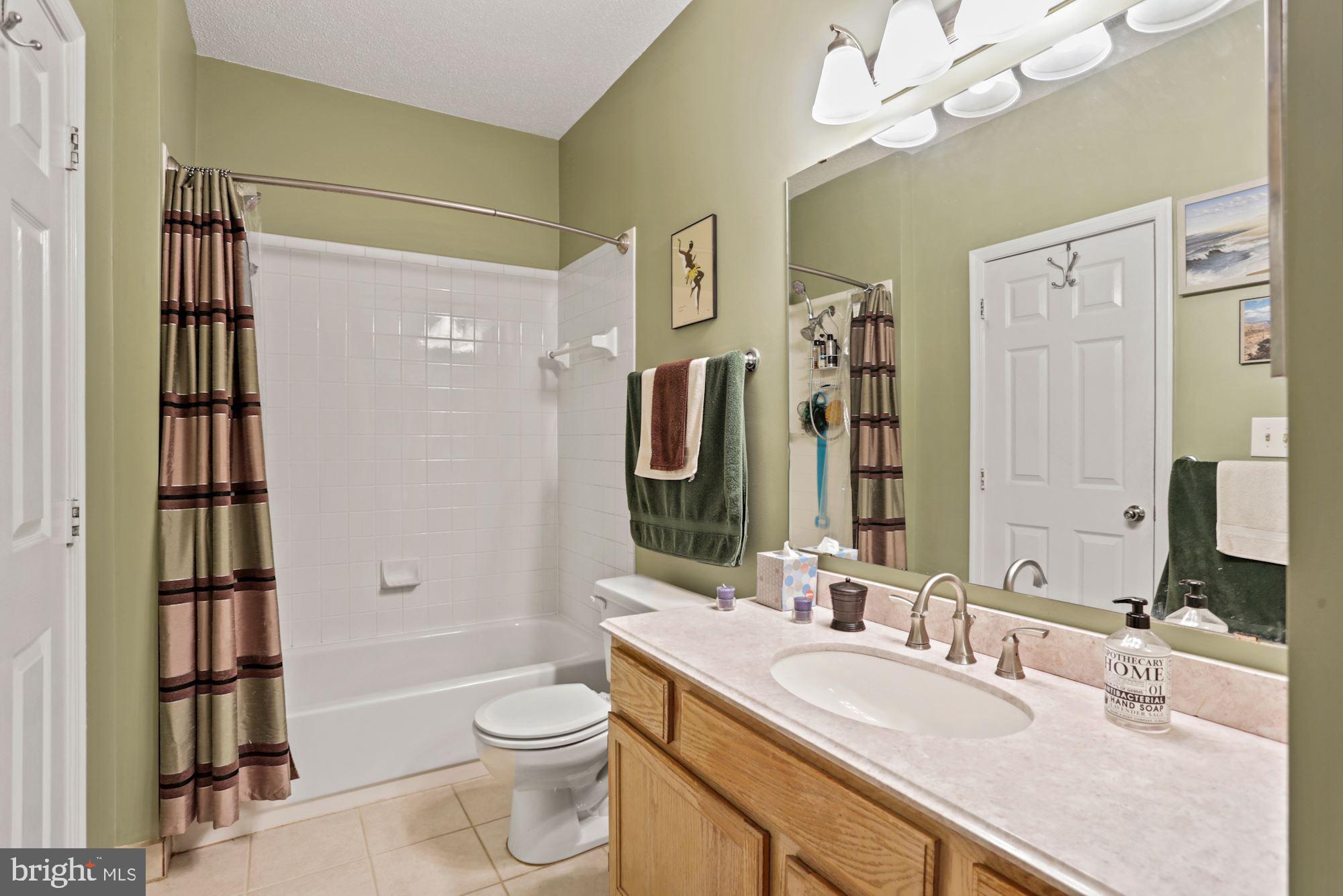 1720 Lake Shore Crest Drive, Unit 22 Reston, VA 20190 - Photo 26 of 35 Large Full Bath with tile shower & floors