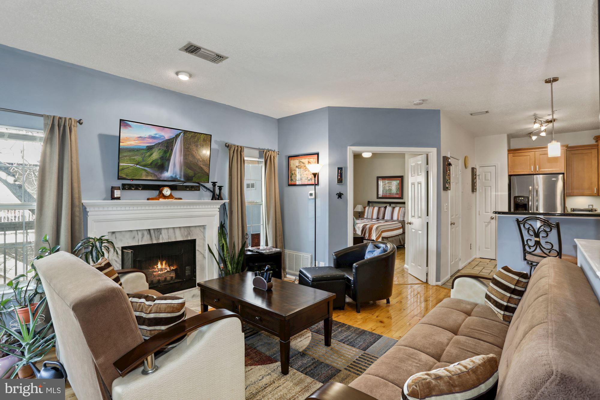 1720 Lake Shore Crest Drive, Unit 22 Reston, VA 20190 - Photo 9 of 35 Open Living Room with tons of Natural light!
