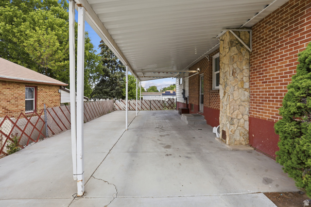 774 37th Street South Ogden, UT 84403 - Photo 33 of 47 Covered concrete driveway with an extended carport structure