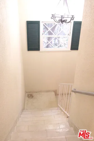 a kitchen with granite countertop a sink and cabinets